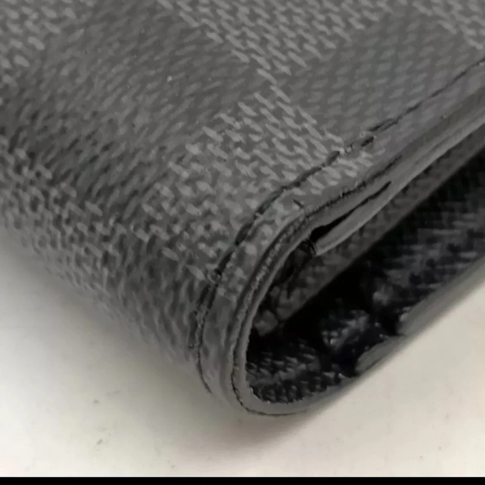 Louis Vuttton Damier Graphite wallet.